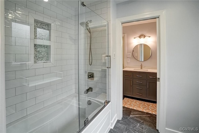 full bath featuring bath / shower combo with glass door, vanity, and marble finish flooring