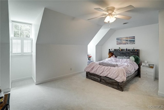 bedroom with carpet flooring, vaulted ceiling, ceiling fan, and baseboards
