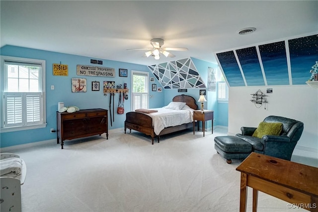 bedroom featuring light colored carpet, ceiling fan, vaulted ceiling, and baseboards