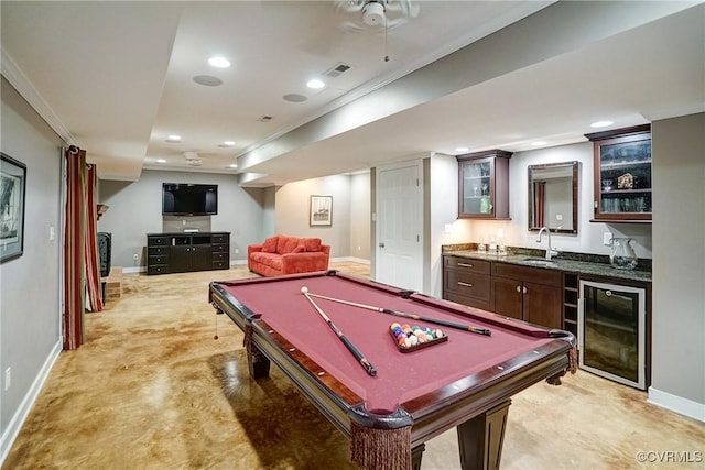 playroom featuring wine cooler, wet bar, baseboards, recessed lighting, and crown molding