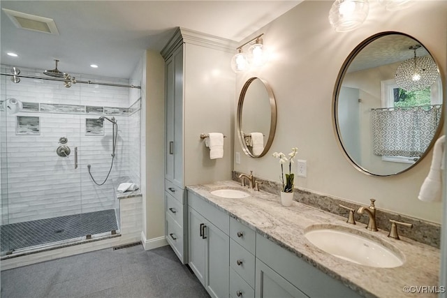 full bath featuring a shower stall, double vanity, recessed lighting, and tile patterned flooring
