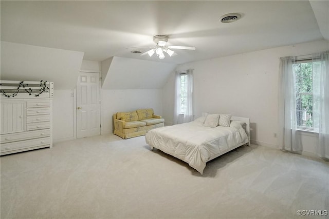 bedroom featuring carpet floors, multiple windows, baseboards, and vaulted ceiling
