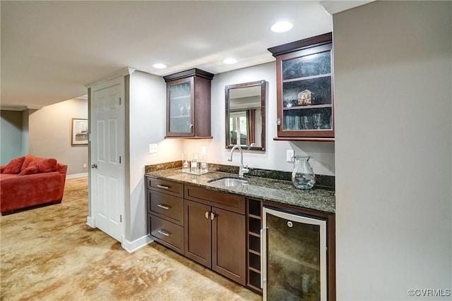indoor wet bar featuring beverage cooler, recessed lighting, and baseboards