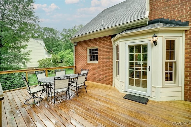 deck featuring outdoor dining space