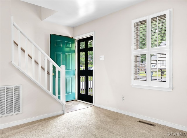 1013 Mill Forest Dr, Midlothian, VA 23113 - carpeted foyer entrance with stairs, baseboards, and french doors