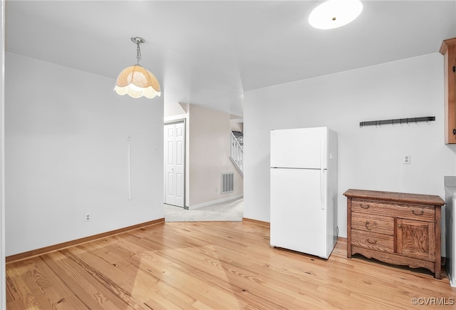 1013 Mill Forest Dr, Midlothian, VA 23113 - kitchen with freestanding refrigerator, light wood-type flooring, baseboards, and hanging light fixtures
