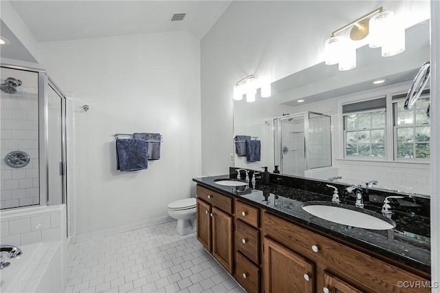 full bathroom featuring a stall shower, tile patterned flooring, baseboards, a garden tub, and double vanity