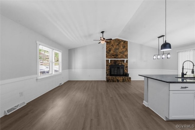 7408 Newbys Ct, Chesterfield, VA 23832 - unfurnished living room with ceiling fan, dark wood-style flooring, a fireplace, a sink, and lofted ceiling