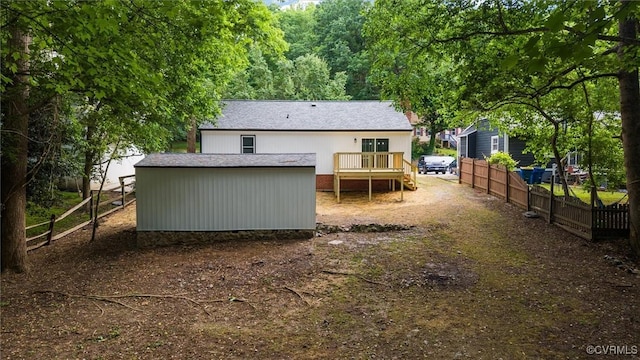 7408 Newbys Ct, Chesterfield, VA 23832 - rear view of house featuring fence, a wooden deck, an outbuilding, and a storage shed