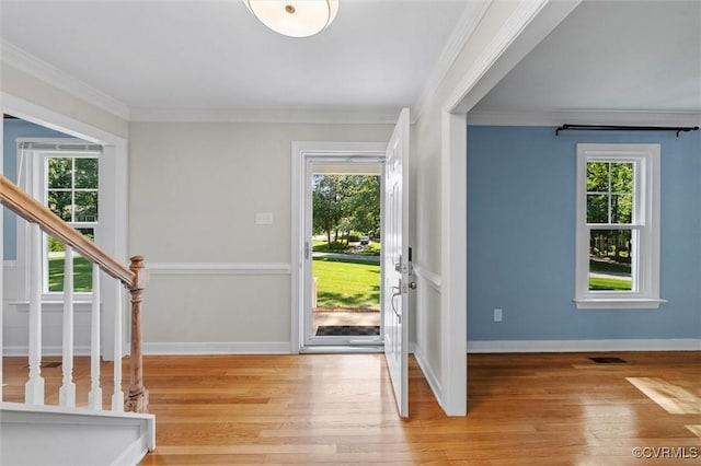 2430 Olde Stone Rd, Midlothian, VA 23113 - foyer with healthy amount of natural light, crown molding, light wood-style flooring, stairs, and baseboards