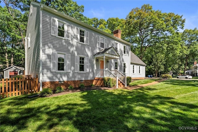 2430 Olde Stone Rd, Midlothian, VA 23113 - colonial inspired home featuring a chimney and view of wooded area