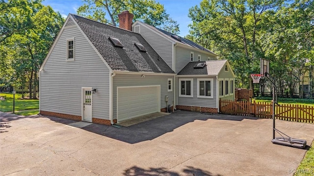 2430 Olde Stone Rd, Midlothian, VA 23113 - rear view of house featuring driveway, a chimney, and a garage