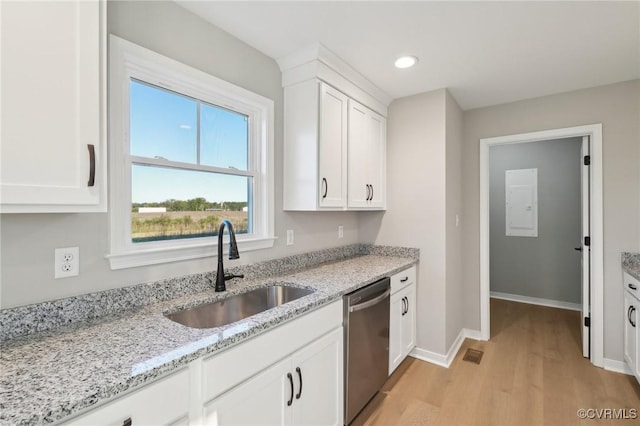 14057 Robinson Rd, Stony Creek, VA 23882 - kitchen featuring dishwasher, a sink, light wood-style floors, baseboards, and white cabinets