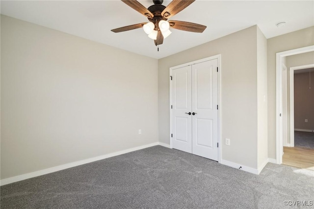 14057 Robinson Rd, Stony Creek, VA 23882 - unfurnished bedroom featuring carpet flooring, a closet, baseboards, and ceiling fan