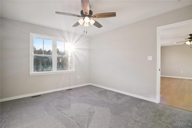 14057 Robinson Rd, Stony Creek, VA 23882 - carpeted empty room with ceiling fan and baseboards