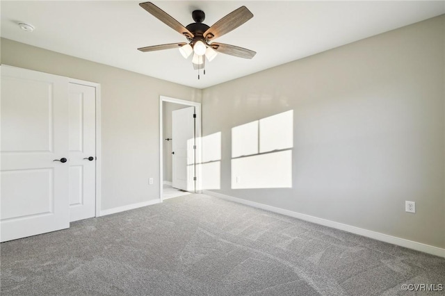 14057 Robinson Rd, Stony Creek, VA 23882 - unfurnished bedroom featuring carpet floors, baseboards, and a ceiling fan