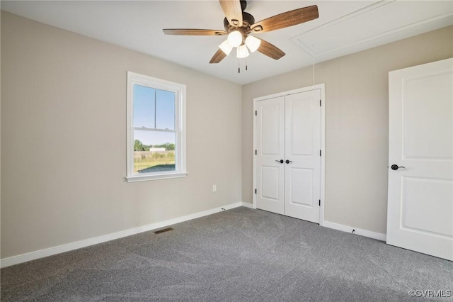 14057 Robinson Rd, Stony Creek, VA 23882 - unfurnished bedroom with attic access, carpet flooring, baseboards, and a closet
