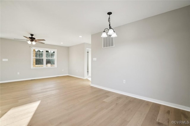 14057 Robinson Rd, Stony Creek, VA 23882 - empty room with light wood finished floors, baseboards, ceiling fan, recessed lighting, and a chandelier