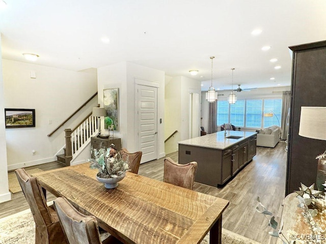 5112 Old Main St, Henrico, VA 23231 - dining space featuring light wood-style flooring, baseboards, stairs, and recessed lighting