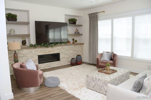 5112 Old Main St, Henrico, VA 23231 - living area featuring wood finished floors, healthy amount of natural light, a fireplace, and baseboards