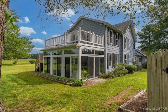 60 Edwards Landing Rd, Gwynn, VA 23066 - back of house featuring a balcony, a sunroom, and a yard