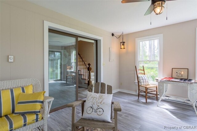60 Edwards Landing Rd, Gwynn, VA 23066 - dining area with stairway, wood finished floors, a ceiling fan, and baseboards