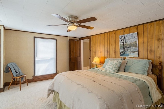 60 Edwards Landing Rd, Gwynn, VA 23066 - bedroom featuring light colored carpet, wood walls, ceiling fan, and baseboards