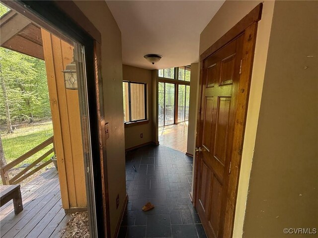 hallway featuring baseboards