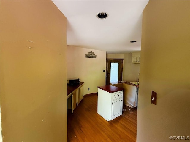 hallway featuring dark wood-type flooring