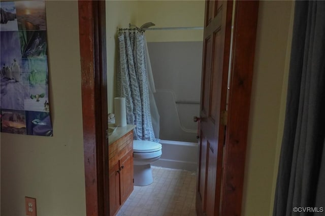 full bath featuring tile patterned floors, vanity, shower / bathtub combination with curtain, and toilet