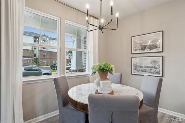 6016 Banyan Ln, Chesterfield, VA 23234 - dining space featuring a chandelier, wood finished floors, and baseboards