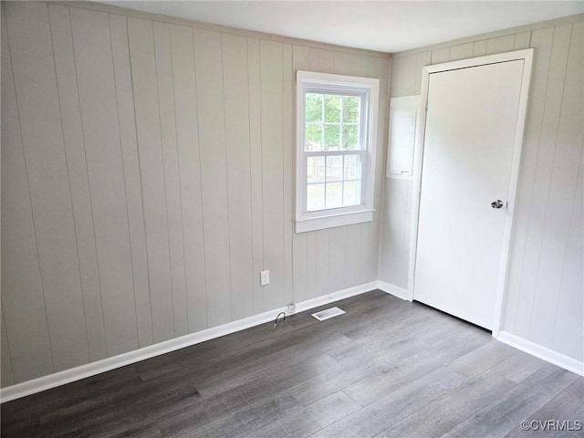 11400 Weyanoke Rd, Charles City, VA 23030 - empty room featuring dark wood finished floors and wooden walls
