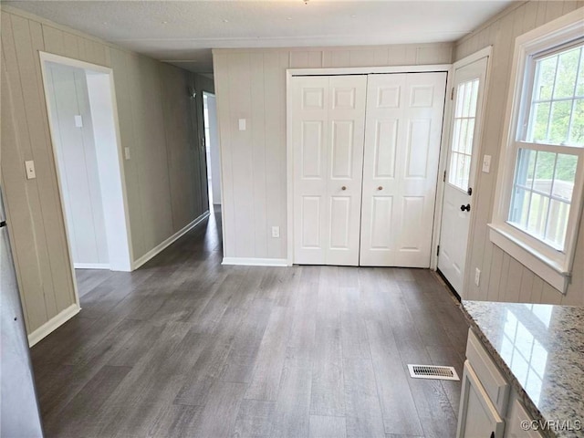 11400 Weyanoke Rd, Charles City, VA 23030 - foyer entrance featuring dark wood-style flooring and wooden walls