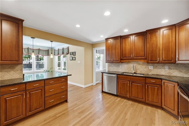 13951 Whitechapel Rd, Midlothian, VA 23113 - kitchen featuring a sink, appliances with stainless steel finishes, baseboards, light wood finished floors, and backsplash
