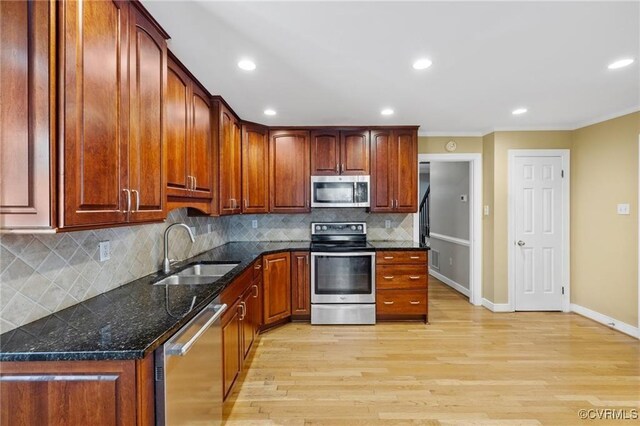 13951 Whitechapel Rd, Midlothian, VA 23113 - kitchen with appliances with stainless steel finishes, a sink, ornamental molding, baseboards, and light wood-type flooring