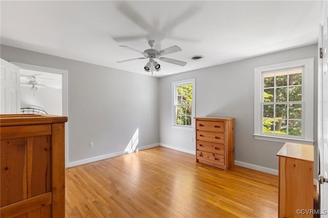 13951 Whitechapel Rd, Midlothian, VA 23113 - bedroom with multiple windows, light wood-type flooring, baseboards, and a ceiling fan