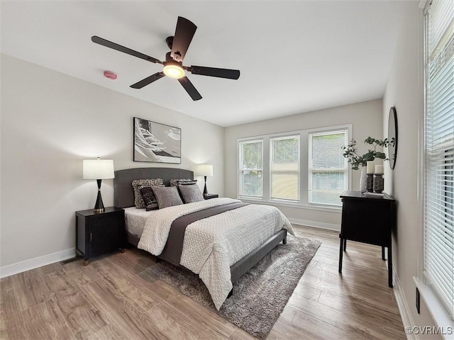 3885 Strawberry Plains Rd, Williamsburg, VA 23188 - bedroom with baseboards, light wood-style floors, and ceiling fan