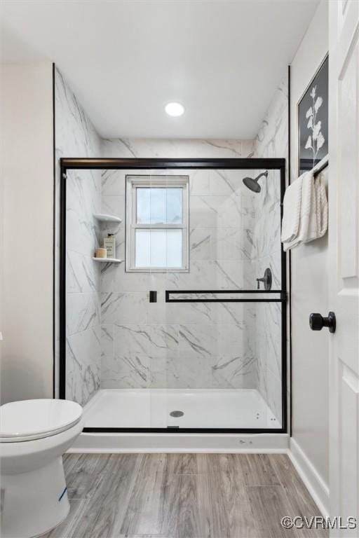 3885 Strawberry Plains Rd, Williamsburg, VA 23188 - full bath with a marble finish shower, toilet, and wood finished floors