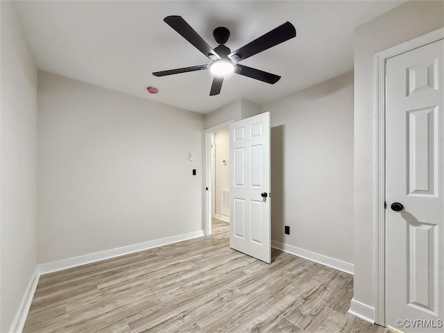 3885 Strawberry Plains Rd, Williamsburg, VA 23188 - unfurnished bedroom featuring light wood-style floors, baseboards, and ceiling fan