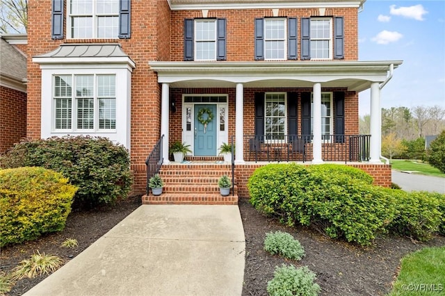 16400 Orchard Tavern Pl, Moseley, VA 23120 - doorway to property featuring brick siding and a porch