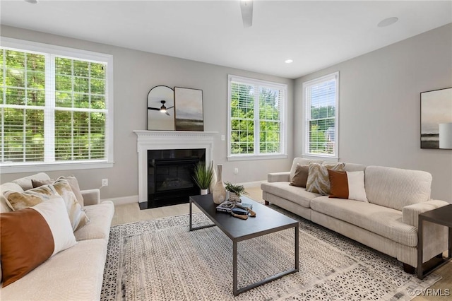 16400 Orchard Tavern Pl, Moseley, VA 23120 - living room featuring wood finished floors, baseboards, a fireplace with flush hearth, a ceiling fan, and recessed lighting