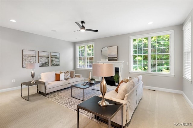 16400 Orchard Tavern Pl, Moseley, VA 23120 - living area featuring a ceiling fan, baseboards, a glass covered fireplace, light colored carpet, and recessed lighting