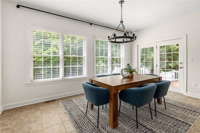 16400 Orchard Tavern Pl, Moseley, VA 23120 - dining room featuring a chandelier, healthy amount of natural light, baseboards, and light tile patterned flooring