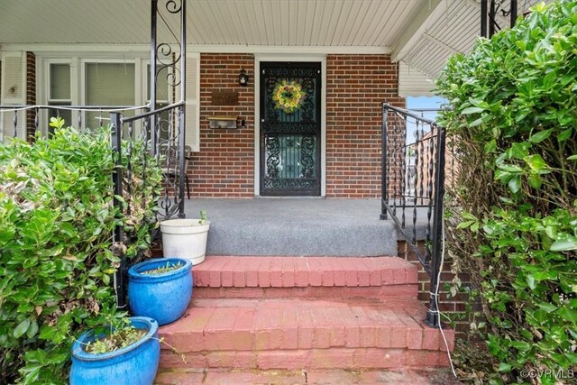 322 St Matthew St, Petersburg, VA 23803 - entrance to property featuring brick siding and covered porch