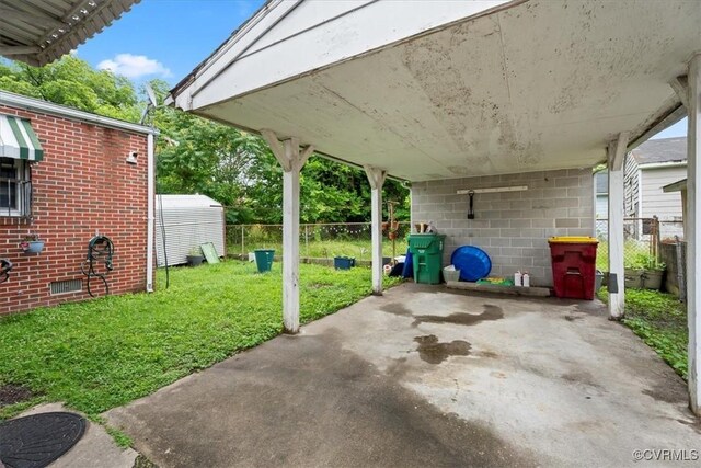 322 St Matthew St, Petersburg, VA 23803 - view of patio featuring a carport