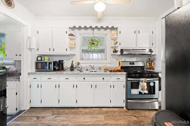 322 St Matthew St, Petersburg, VA 23803 - kitchen featuring stainless steel appliances, a sink, under cabinet range hood, open shelves, and ornamental molding
