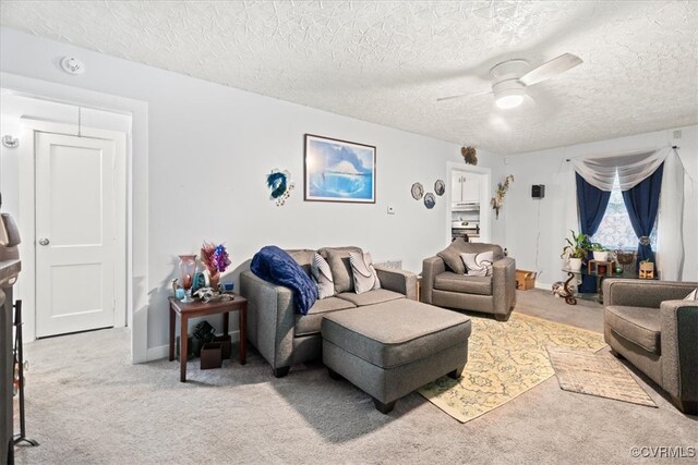 322 St Matthew St, Petersburg, VA 23803 - living area featuring ceiling fan, a textured ceiling, and carpet