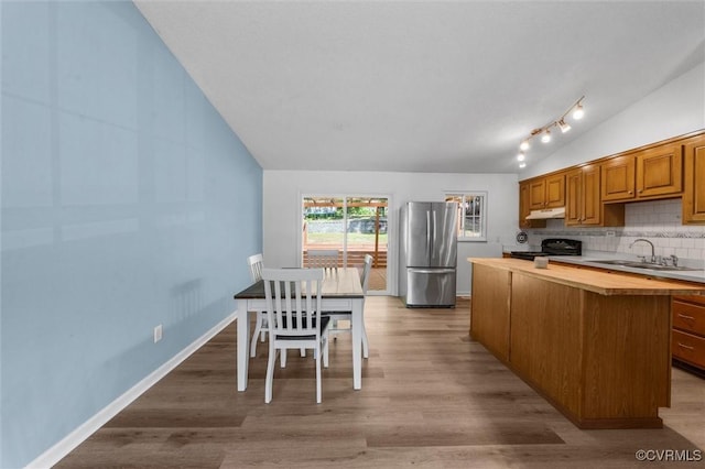 9120 Pepperidge Rd, Chesterfield, VA 23236 - kitchen featuring freestanding refrigerator, a sink, vaulted ceiling, wood counters, and black range