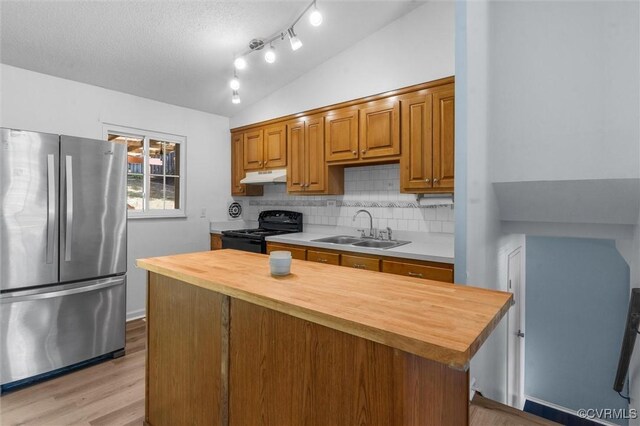 9120 Pepperidge Rd, Chesterfield, VA 23236 - kitchen featuring freestanding refrigerator, black electric range, a sink, wood counters, and under cabinet range hood