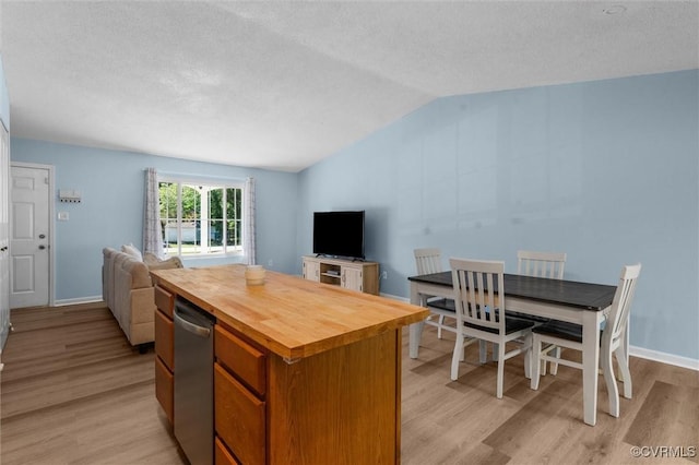 9120 Pepperidge Rd, Chesterfield, VA 23236 - kitchen with wood counters, open floor plan, light wood-style flooring, vaulted ceiling, and a kitchen island